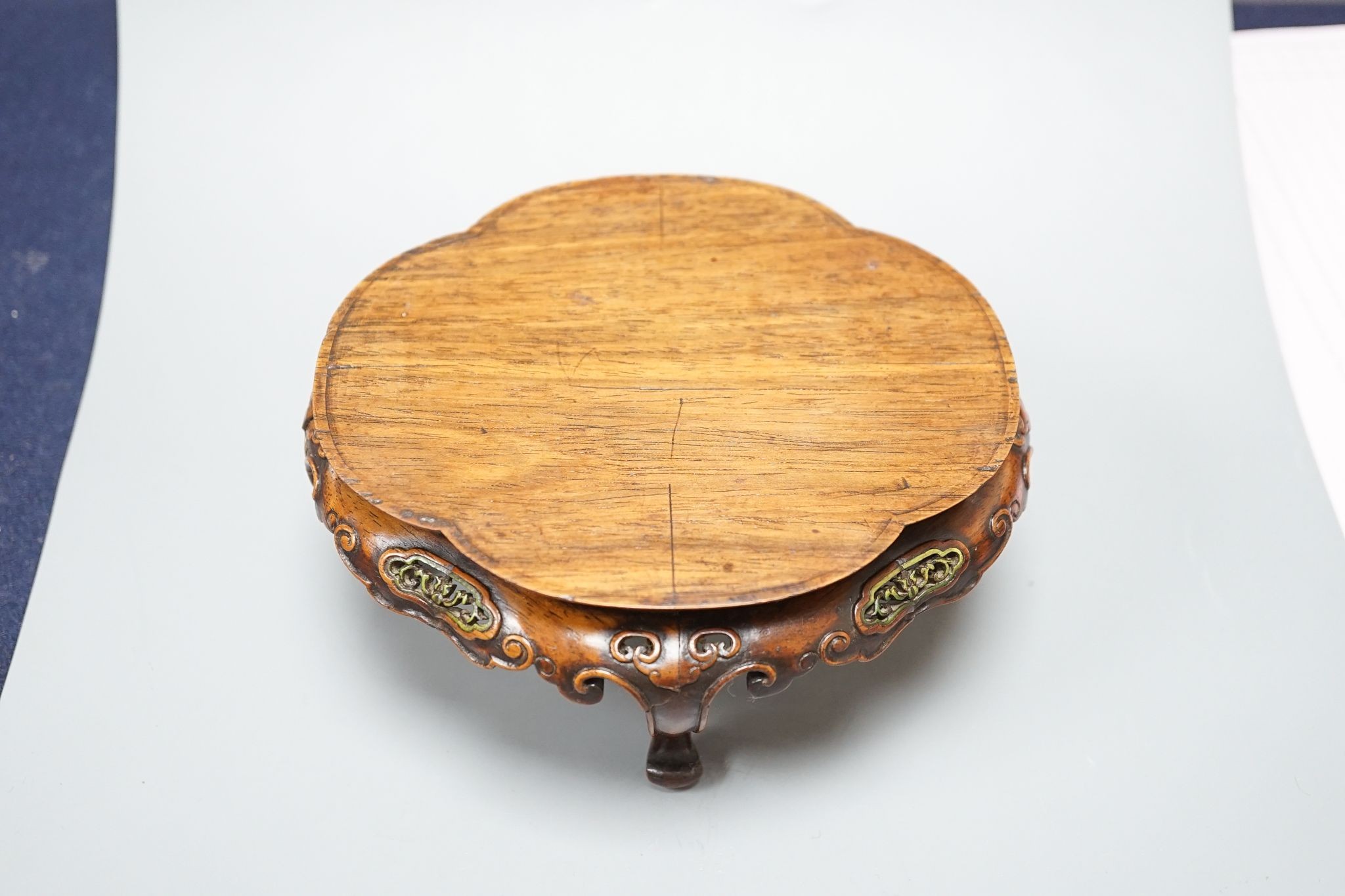 A fine Chinese oval hardwood and green stained Ivory inset stand, Qing dynasty, lacking stretcher, 15 cms wide.